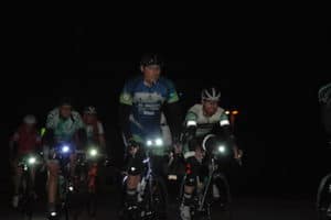 cyclists riding at night